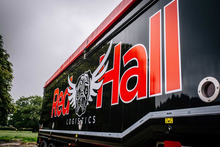 Close-up of the Red Hall Logistics livery on a bulk feed trailer