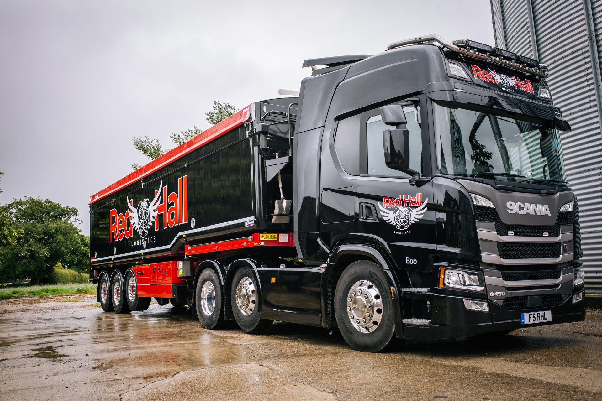Red Hall Logistics bulk feed lorry with Muldoon blowing system, parked at a farm